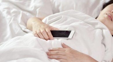 woman-asleep-holding-phone